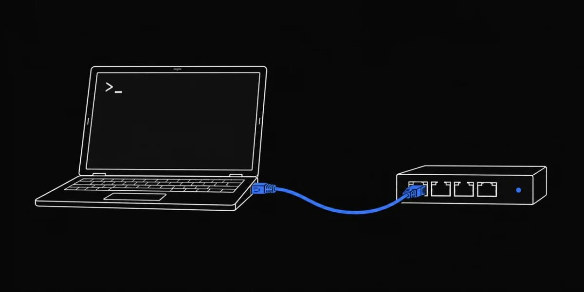 Laptop connected to an Ethernet switch for network troubleshooting.